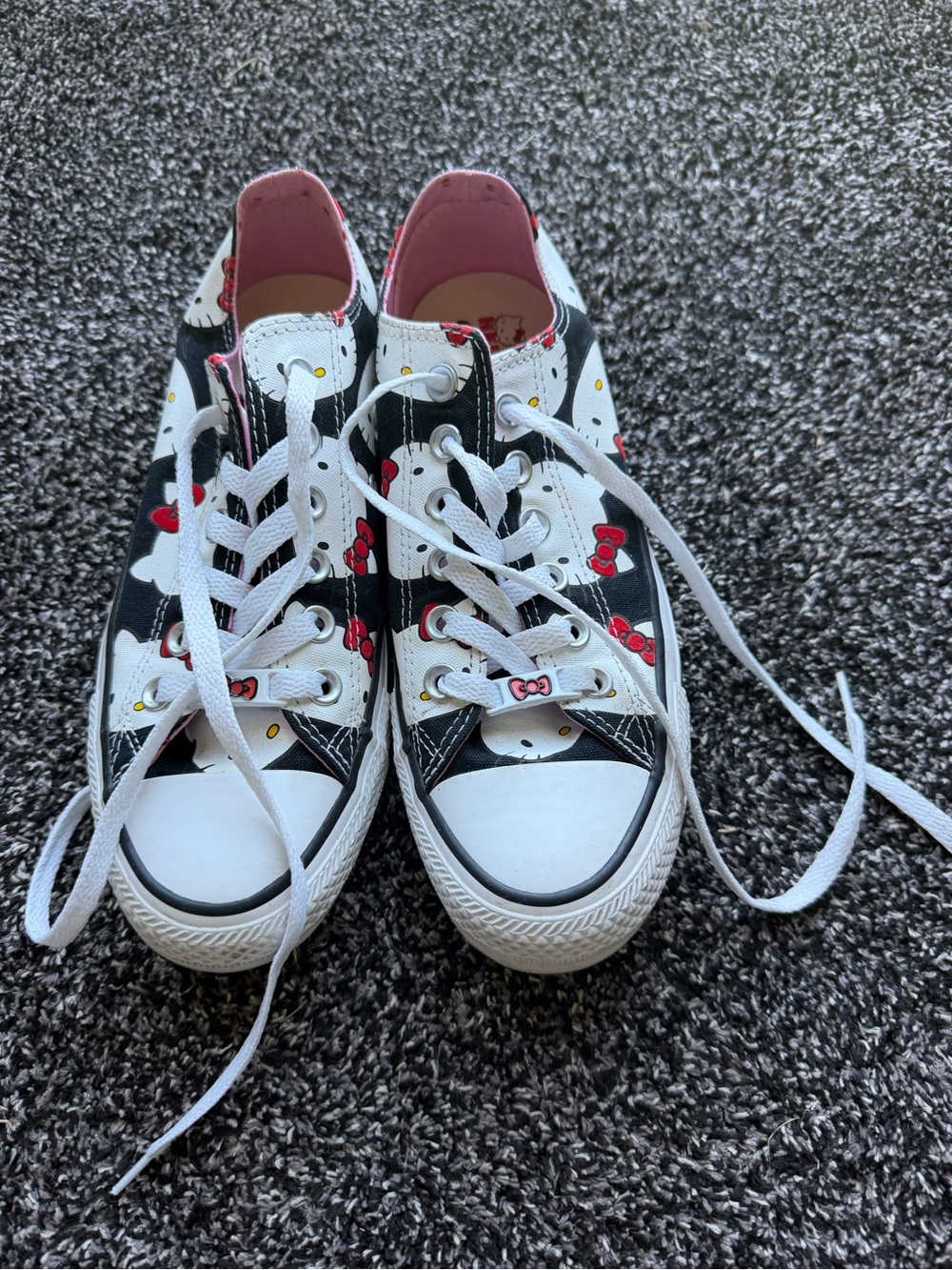 Converse Low-Top Sneakers in Black, White & Pink with Hello Kitty Bow Accents